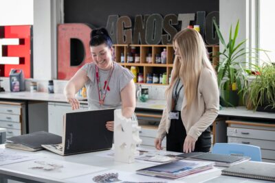 Staff with student in classroom