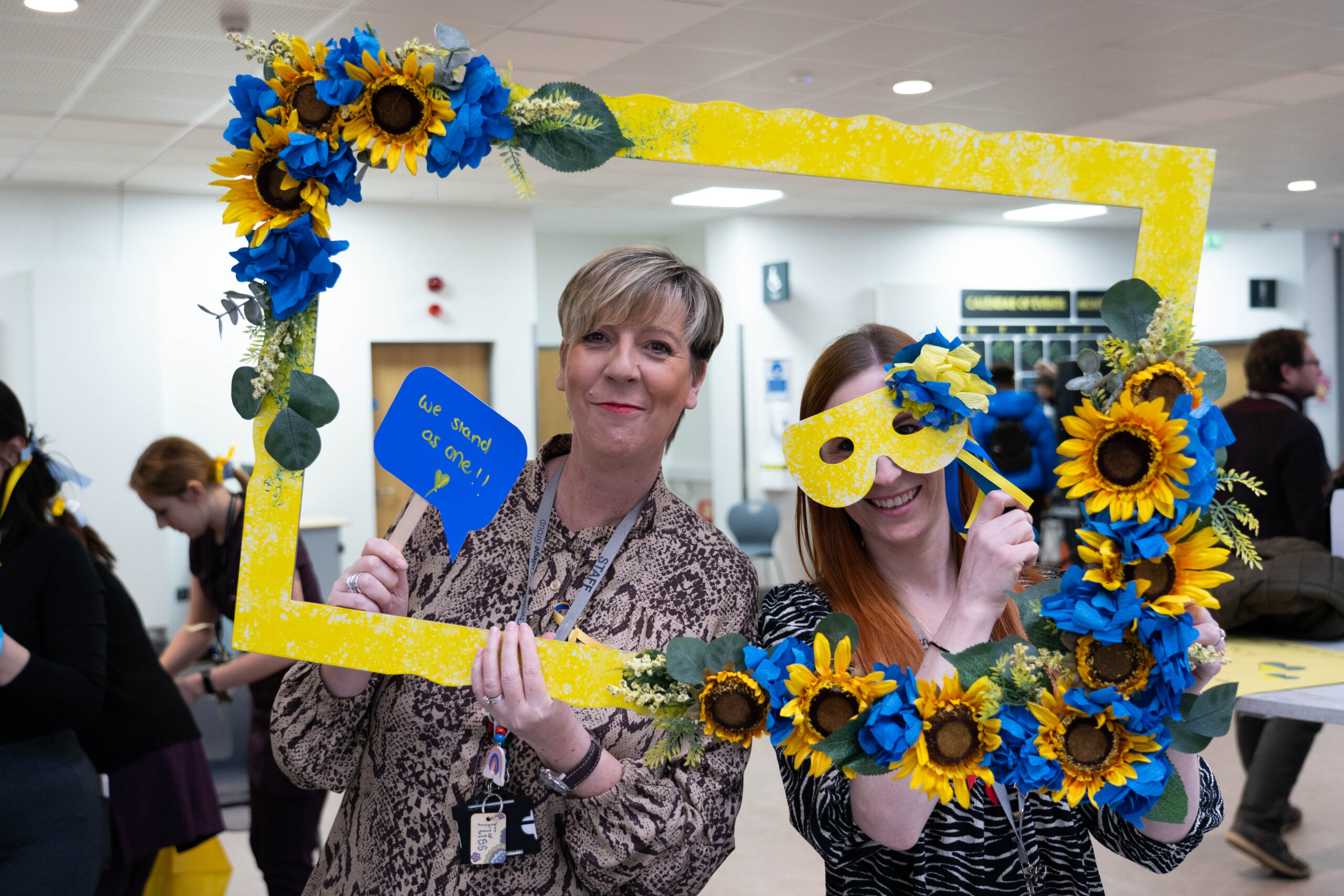 two staff members in Ukraine colours