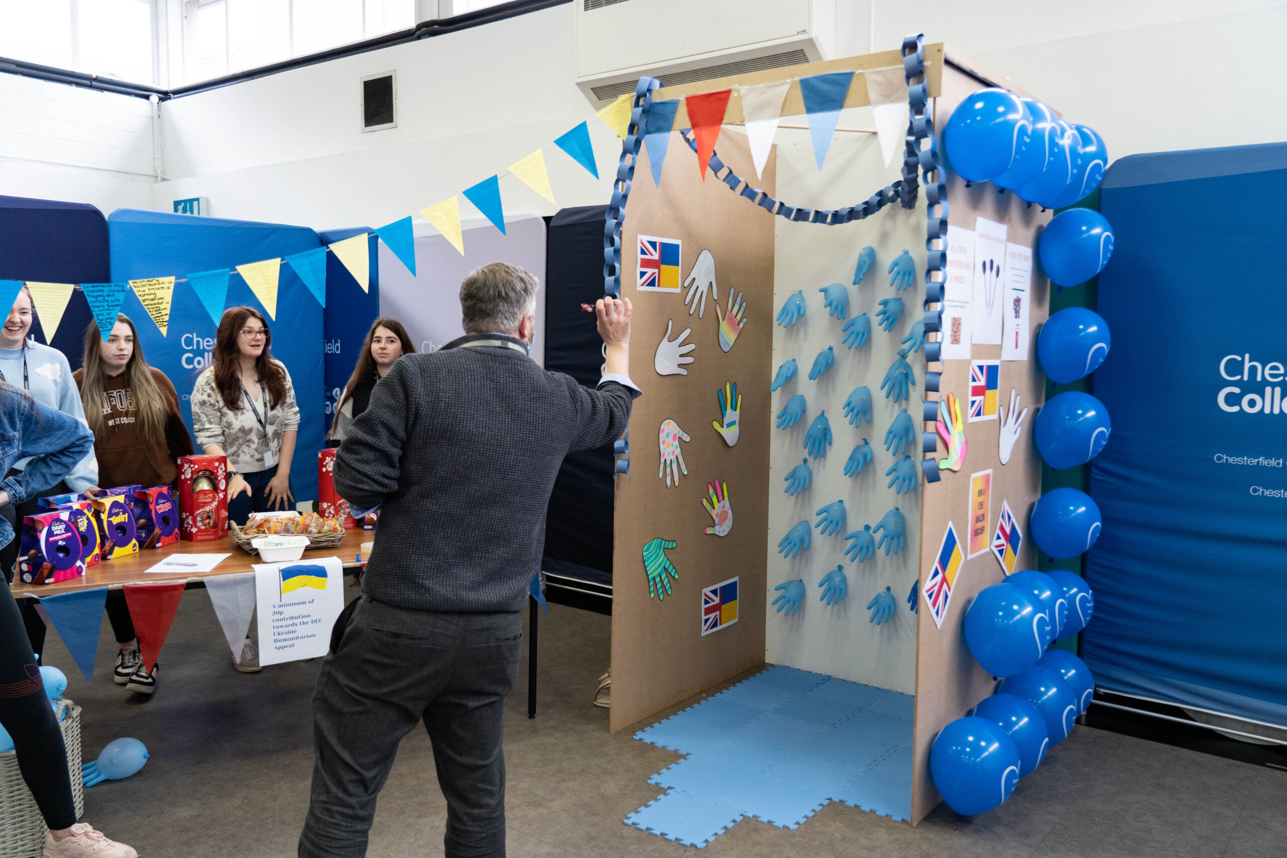 David throwing darts on the health and social care stand 