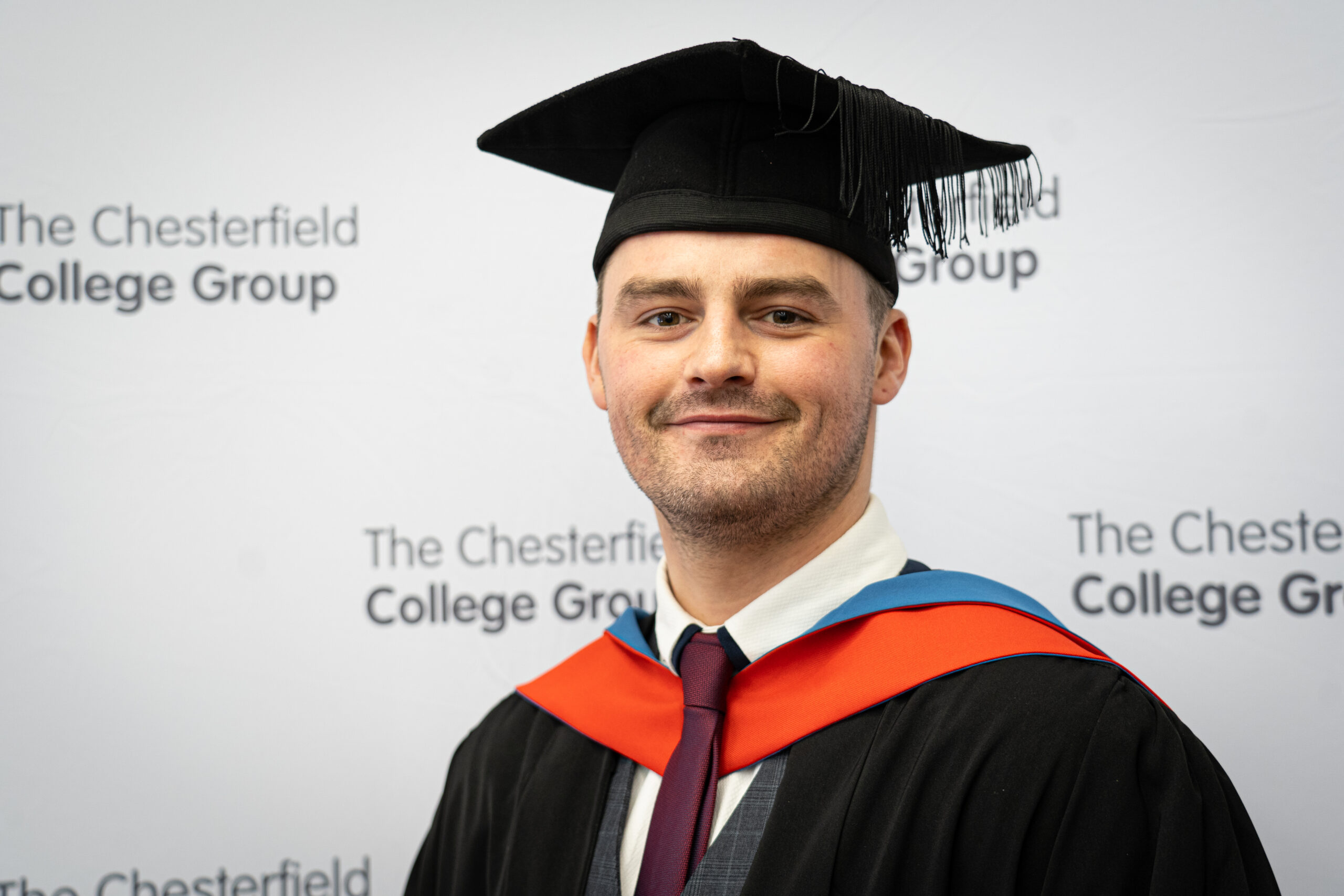 A photo of Alex Hughes at Graduation