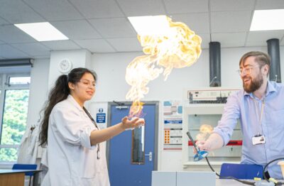 Student doing experiment in science classroom